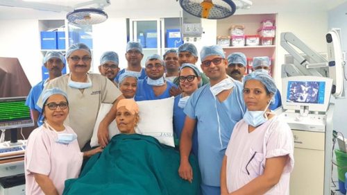 Dr. Paresh Doshi and Team with a DBS patient Dr. Paresh Doshi and Team with a DBS patient