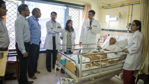 Dr. Paresh Doshi and Team with a patient Dr. Paresh Doshi and Team with a patient